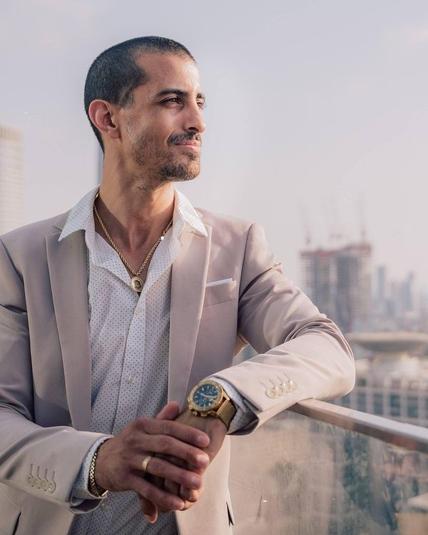 Portrait of Samuel Okafor on a city rooftop