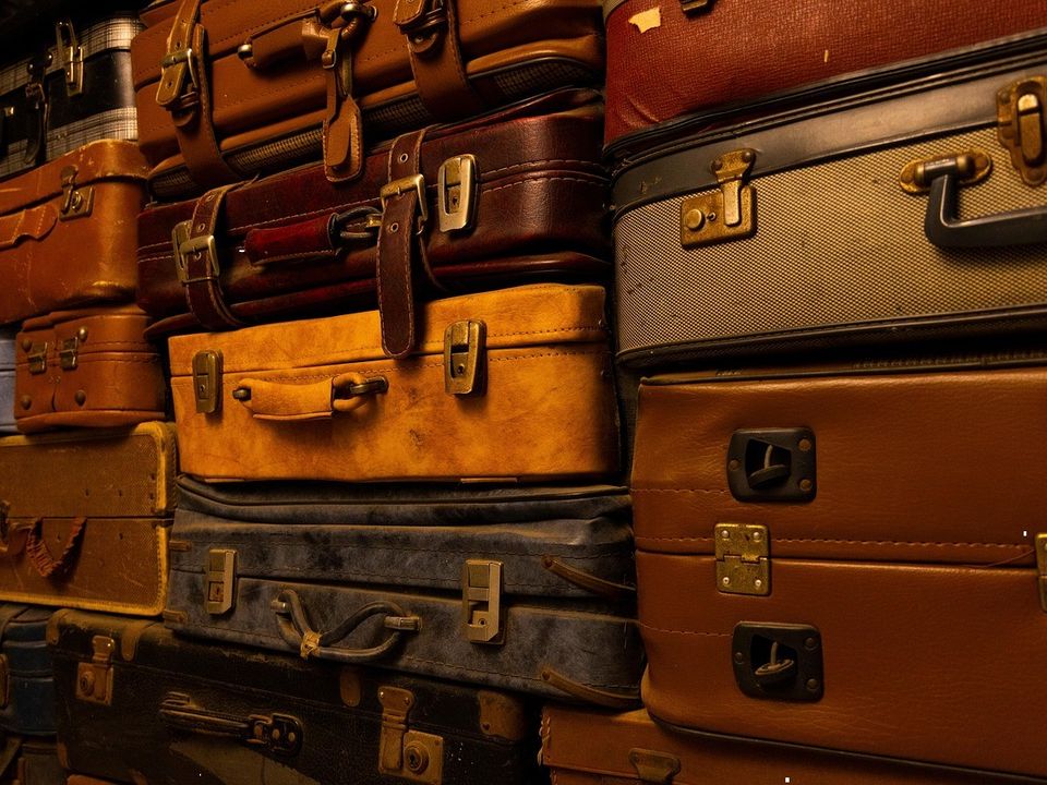 A stack of vintage leather suitcases