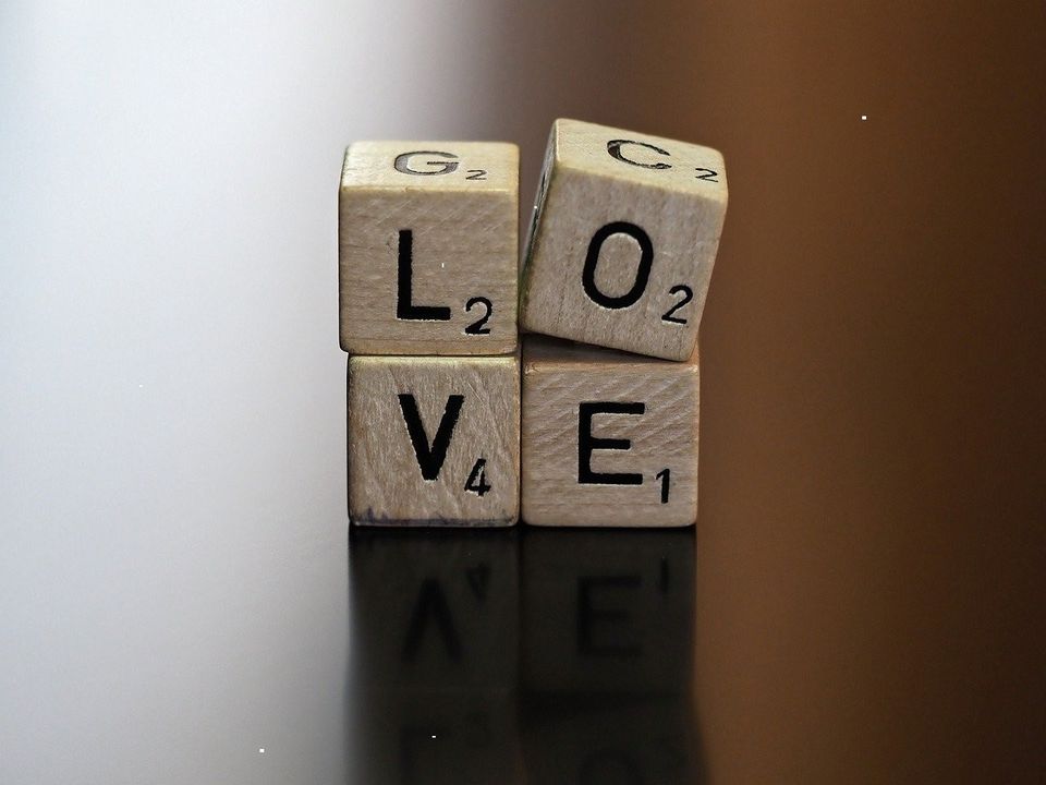 Wooden letter tiles spelling a word on a table